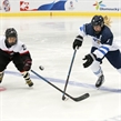 PREROV, CZECH REPUBLIC - JANUARY 08:  Finland's Petra Nieminen #9 and Japan's Remi Koyama #21 chase down a loose puck during preliminary round action at the 2017 IIHF Ice Hockey U18 Women's World Championship. (Photo by Steve Kingsman/HHOF-IIHF Images)

